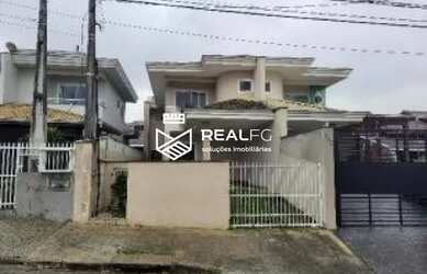 Imagem: A casa possui 3 Dormitórios, 1 Banheiro, 1 Vaga na garagem