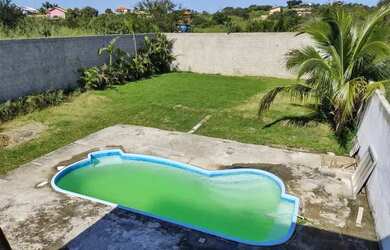 Imagem: A casa possui 2 Dormitórios, 5 Vagas na garagem e está localizado