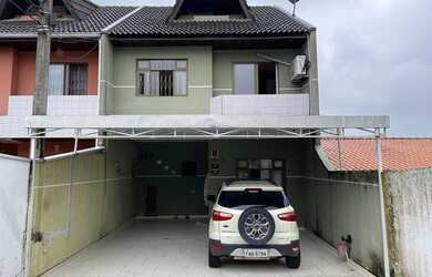 Imagem: A casa possui 3 Dormitórios, 3 Banheiros, 3 Vagas na garagem