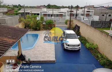 Imagem: A casa possui 4 Dormitórios, 2 Banheiros, 4 Vagas na garagem