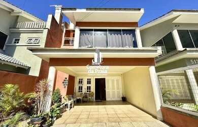 Imagem: A casa e possui 4 Dormitórios, Suítes, 3 Banheiros, 2 Vagas