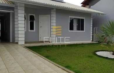 Imagem: A casa possui 3 Dormitórios, 3 Banheiros, 2 Vagas na garagem