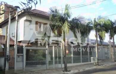 Imagem: A casa possui 4 Dormitórios, 4 Banheiros, 5 Vagas na garagem