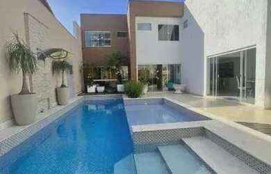 Imagem: A casa possui 5 Dormitórios, 5 Banheiros, 5 Vagas na garagem