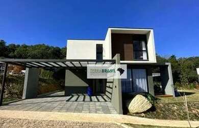 Imagem: A casa possui 3 Dormitórios, 5 Banheiros, 2 Vagas na garagem