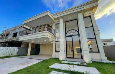 Imagem: A casa possui 5 Dormitórios, 5 Banheiros, 4 Vagas na garagem