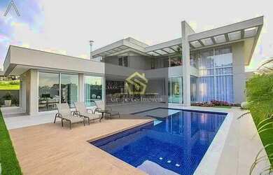 Imagem: A casa possui 4 Dormitórios, 5 Banheiros, 2 Vagas na garagem