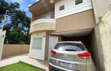 Imagem: A casa possui 3 Dormitórios, 3 Banheiros, 5 Vagas na garagem