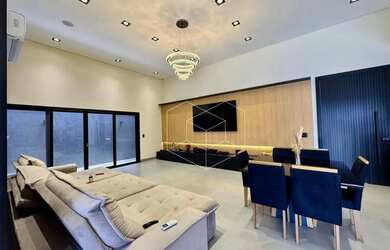 Imagem: A casa possui 3 Dormitórios, 4 Banheiros, 3 Vagas na garagem