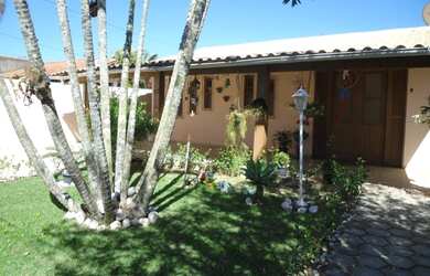 Imagem: A casa possui 3 Dormitórios, 2 Vagas na garagem e está localizado