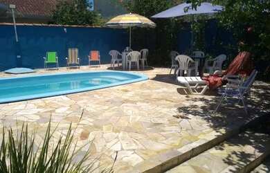 Imagem: A casa possui 5 Dormitórios, 4 Vagas na garagem e está localizado