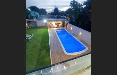 Imagem: A casa em condomínio possui 5 Dormitórios, 5 Banheiros, 2