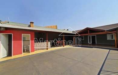 Imagem: A casa possui 2 Dormitórios, 3 Banheiros, 2 Vagas na garagem