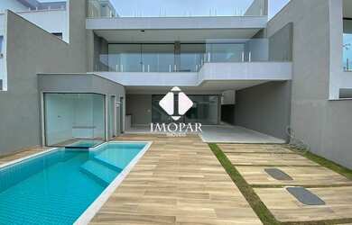 Imagem: A casa em condomínio possui 4 Dormitórios, 5 Banheiros, 2