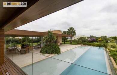 Imagem: A casa possui 5 Dormitórios, 5 Banheiros, 5 Vagas na garagem