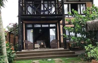 Imagem: A casa possui 3 Dormitórios e 2 Vagas na garagem e está localizado