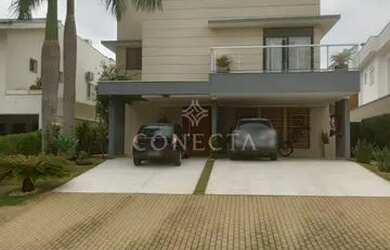 Imagem: A casa possui 3 Dormitórios, 4 Banheiros, 3 Vagas na garagem