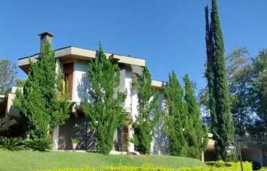 Imagem: A casa em condomínio possui 5 Dormitórios, 5 Banheiros, 4