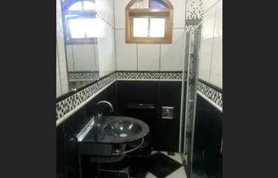 Imagem: A casa possui 3 Dormitórios, 3 Banheiros, 3 Vagas na garagem