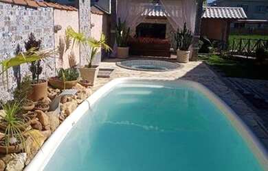 Imagem: A casa possui 3 Dormitórios, 1 Vaga na garagem e está localizado