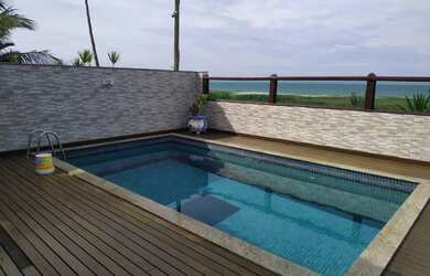 Imagem: A casa possui 4 Dormitórios, 5 Banheiros, 2 Vagas na garagem