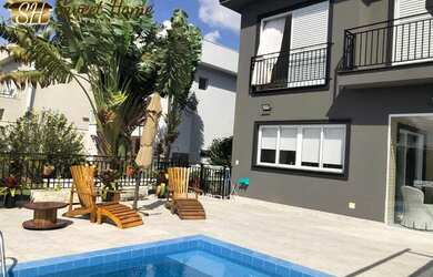 Imagem: A casa possui 4 Dormitórios, 5 Banheiros, 5 Vagas na garagem