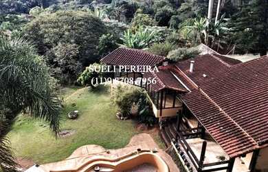 Imagem: A casa possui 3 Dormitórios, 5 Banheiros, 5 Vagas na garagem