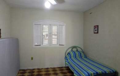 Imagem: A casa possui 2 Dormitórios, 3 Vagas na garagem e está localizado