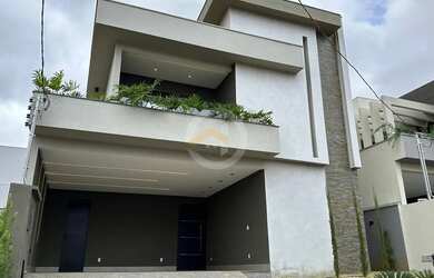 Imagem: A casa possui 3 Dormitórios, 5 Banheiros, 4 Vagas na garagem