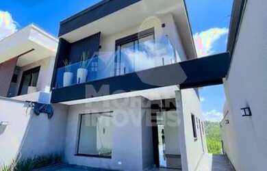 Imagem: A casa possui 3 Dormitórios, 2 Banheiros, 2 Vagas na garagem