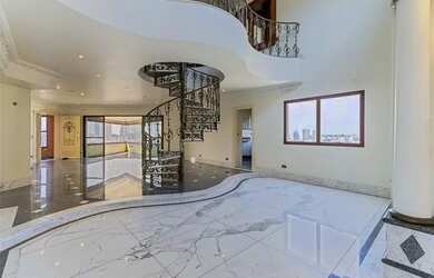 Imagem: A casa possui 3 Dormitórios, 5 Banheiros, 5 Vagas na garagem