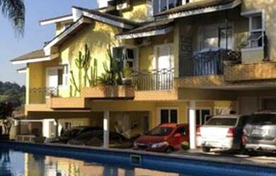 Imagem: A casa em condomínio possui 3 Dormitórios, 4 Banheiros, 3