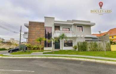 Imagem: A casa em condomínio possui 4 Dormitórios, 4 Banheiros, 245m²