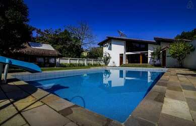 Imagem: A casa possui 5 Dormitórios, 5 Banheiros, 5 Vagas na garagem