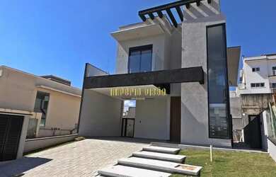 Imagem: A casa possui 3 Dormitórios, 5 Banheiros, 4 Vagas na garagem