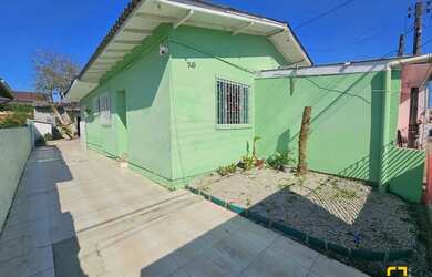 Imagem: A casa à venda possui 3 Dormitórios, 2 Banheiros, 2 Vagas
