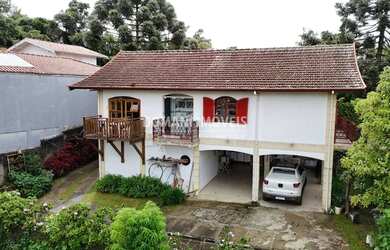 Imagem: A casa possui 4 Dormitórios, 4 Banheiros, 3 Vagas na garagem