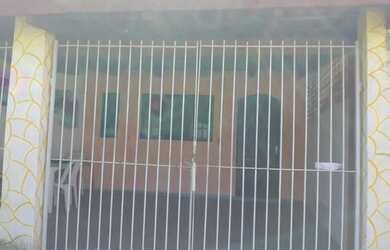 Imagem: A casa possui 2 Dormitórios, 1 Vaga na garagem e está localizado