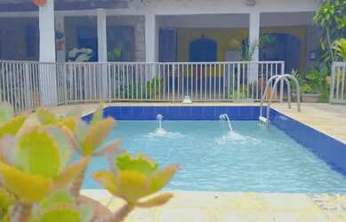 Imagem: A casa possui 4 Dormitórios, 4 Banheiros, 4 Vagas na garagem