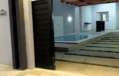 Imagem: A casa possui 3 Dormitórios, 3 Banheiros, 4 Vagas na garagem