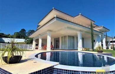 Imagem: A casa em condomínio à venda possui 4 Dormitórios, 5 Banheiros