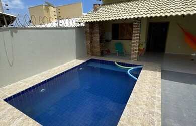 Imagem: A casa possui 3 Dormitórios, 2 Vagas na garagem e está localizado