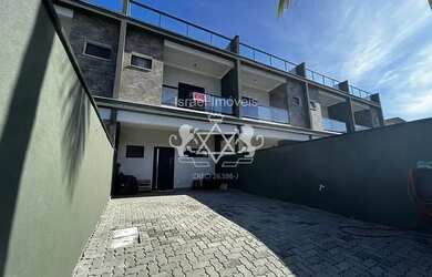 Imagem: A casa possui 2 Dormitórios, 3 Banheiros, 2 Vagas na garagem