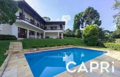 Imagem: A casa possui 4 Dormitórios, 5 Banheiros, 5 Vagas na garagem