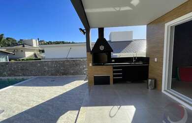 Imagem: A casa em condomínio possui 3 Dormitórios, 3 Banheiros, 4