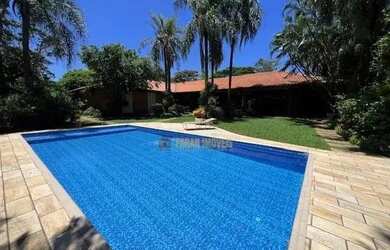 Imagem: A casa possui 3 Dormitórios, 5 Banheiros, 5 Vagas na garagem