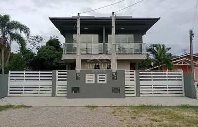 Imagem: A casa possui 2 Dormitórios, 3 Banheiros, 1 Vaga na garagem