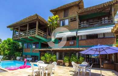 Imagem: A casa possui 5 Dormitórios, 4 Banheiros, 5 Vagas na garagem