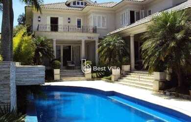 Imagem: A casa em condomínio possui 5 Dormitórios, 5 Banheiros, 5