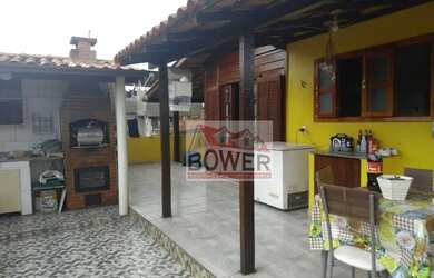 Imagem: A casa possui 5 Dormitórios, 2 Banheiros, 3 Vagas na garagem